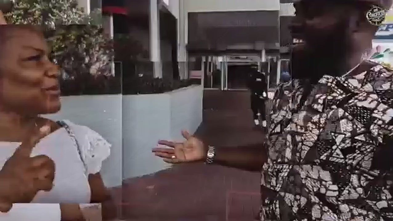 Don Crucifixto in conversation with a woman during an outreach round