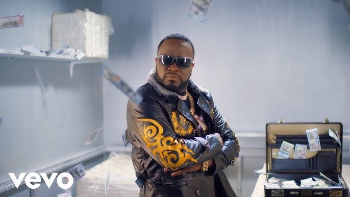 Don Crucifixto in a gold-embroidered jacket on a music video set