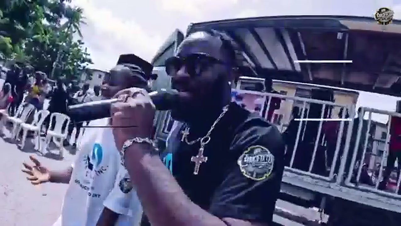 Don Crucifixto on the microphone in front of a Lagos crowd during a DC Chronicles shoot